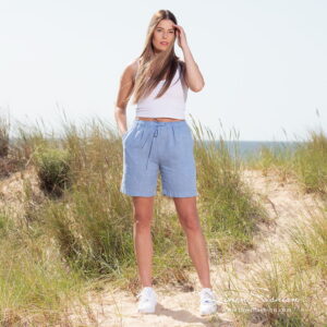 linen blue shorts in full view.