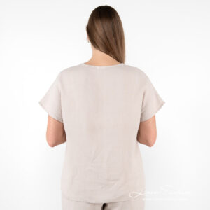 beige linen blouse from backside.