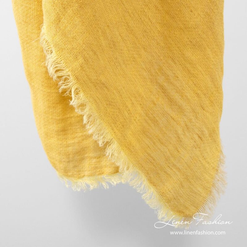 Yellow colored linen scarf.