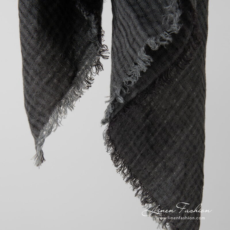 grey linen scarf with loose fringes around.