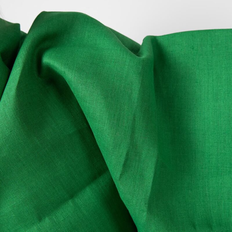 Linen fabric emerald green colour detail edge view